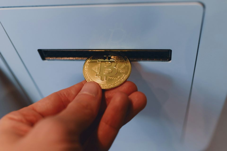 A person is holding a bitcoin